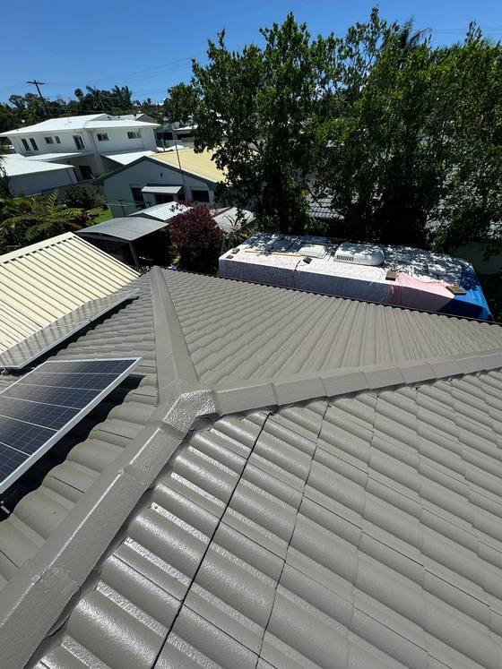 A cream tile roof with solar panels